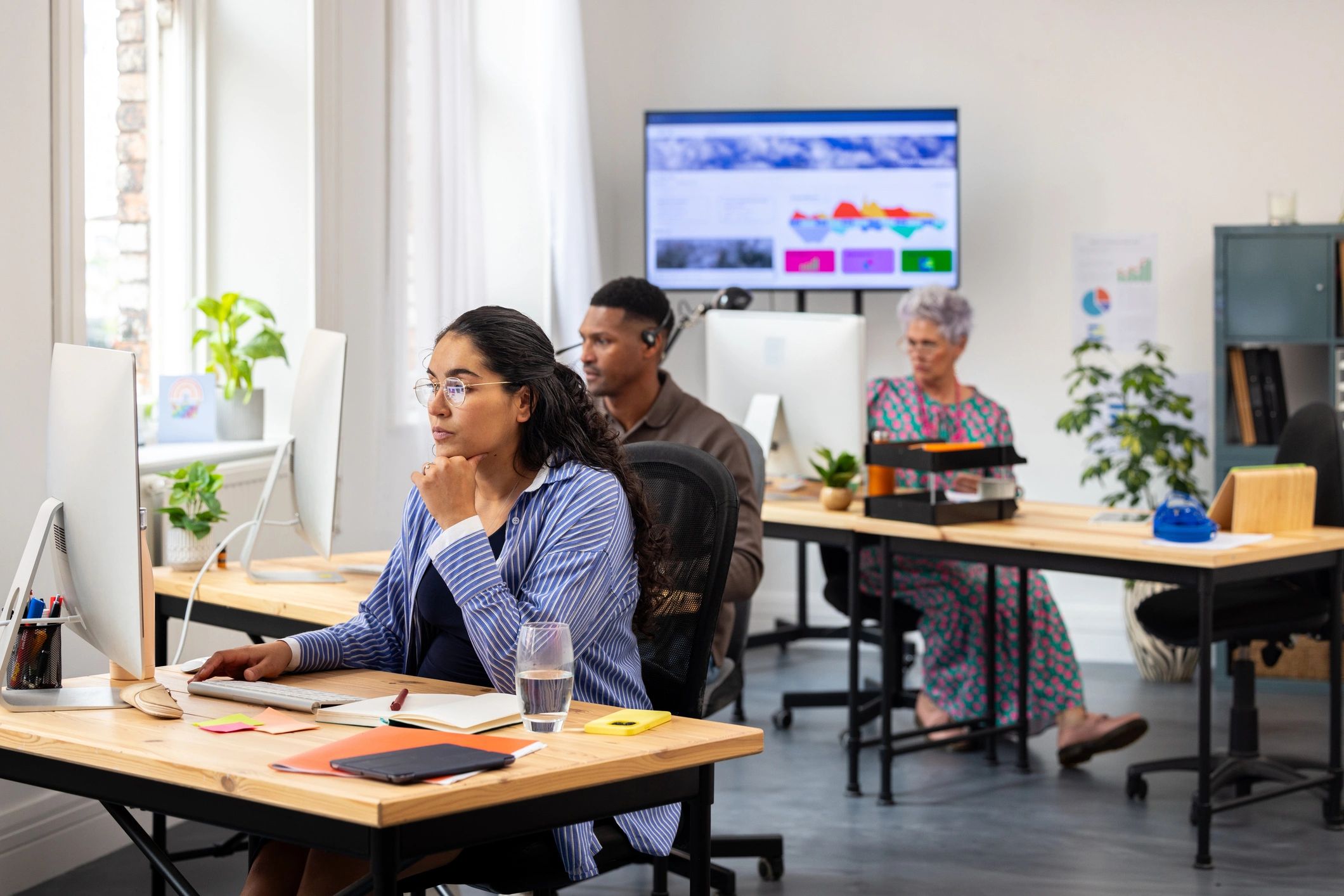 Professional working in a modern newsroom office